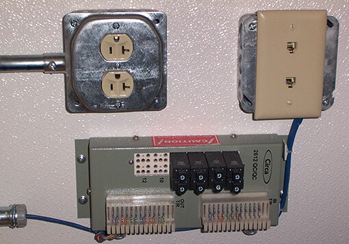 an electrical circuit with two power outlet and one power supply, it is inside a storage container.